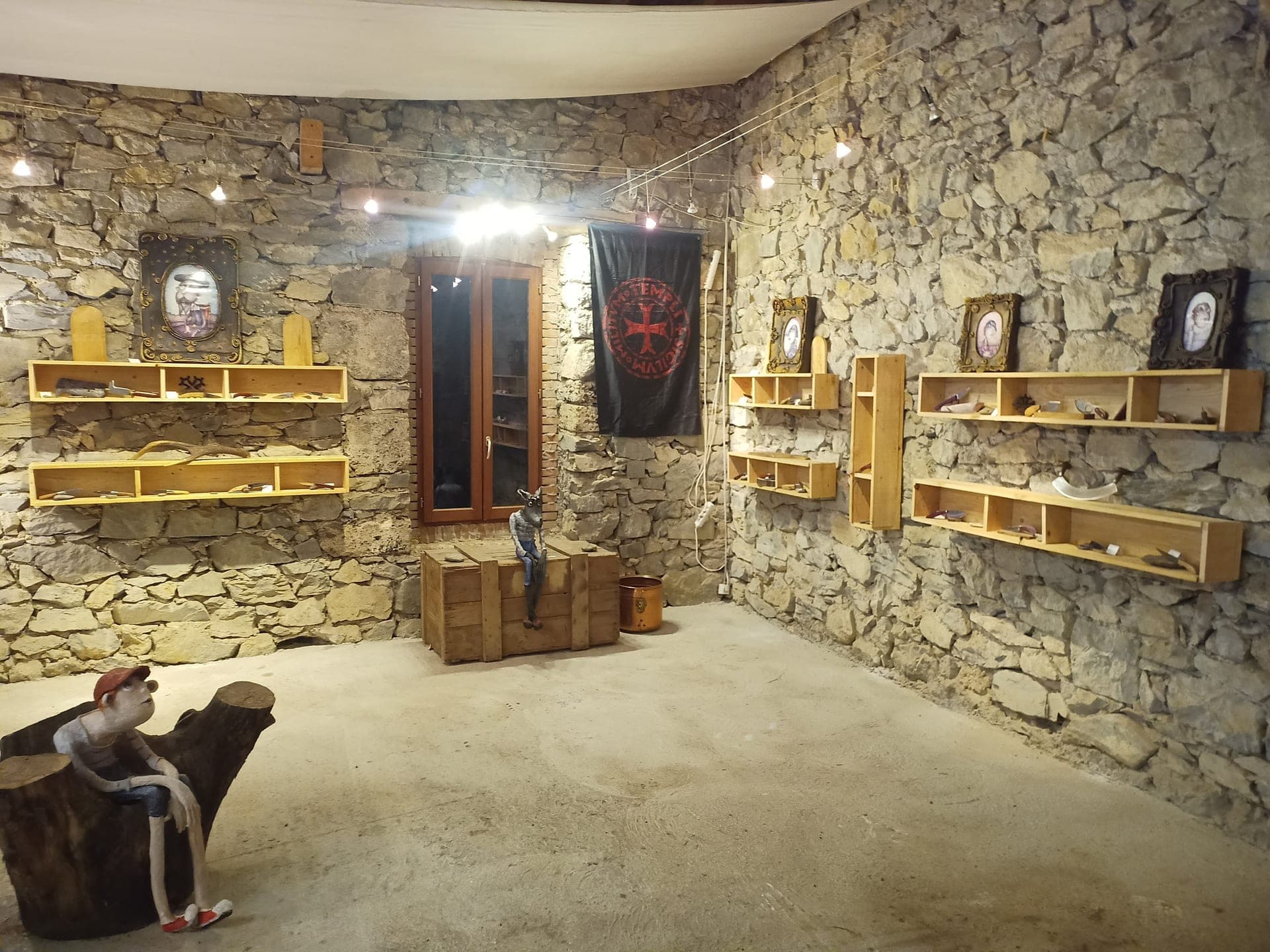 The workshop's stone-walled exhibition room in Cathar Country, near the Château de Puilaurens